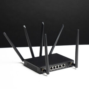 Angled view of the X-LINK router showing its antennas and rear Ethernet ports.