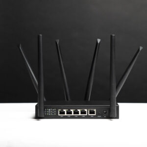 Rear view of the X-LINK router showing its antennas and Ethernet ports on a black background.
